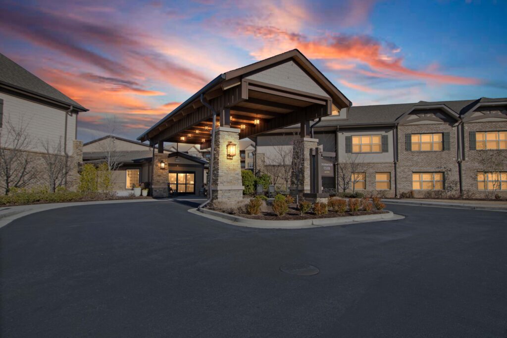A photo of the Celebration Village Acworth building at dusk.